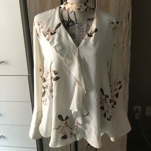 White blouse with floral detail